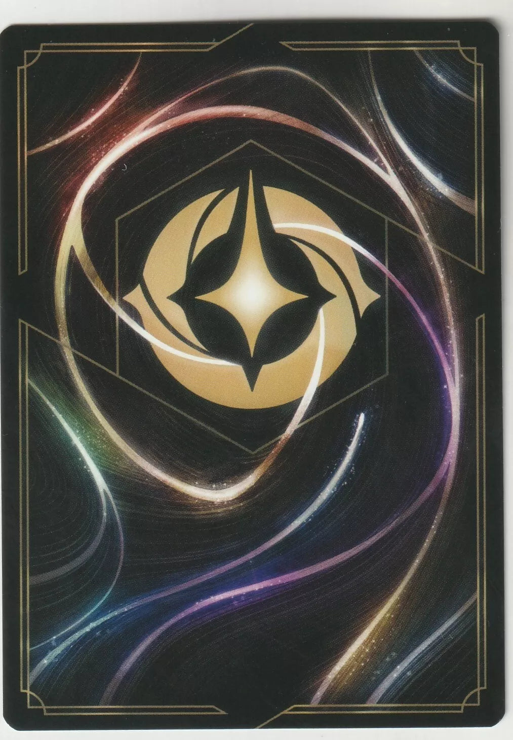 Lorcana card back design featuring swirling streaks of light with a cosmic-like dark background and the Lorcana symbol at the center.
