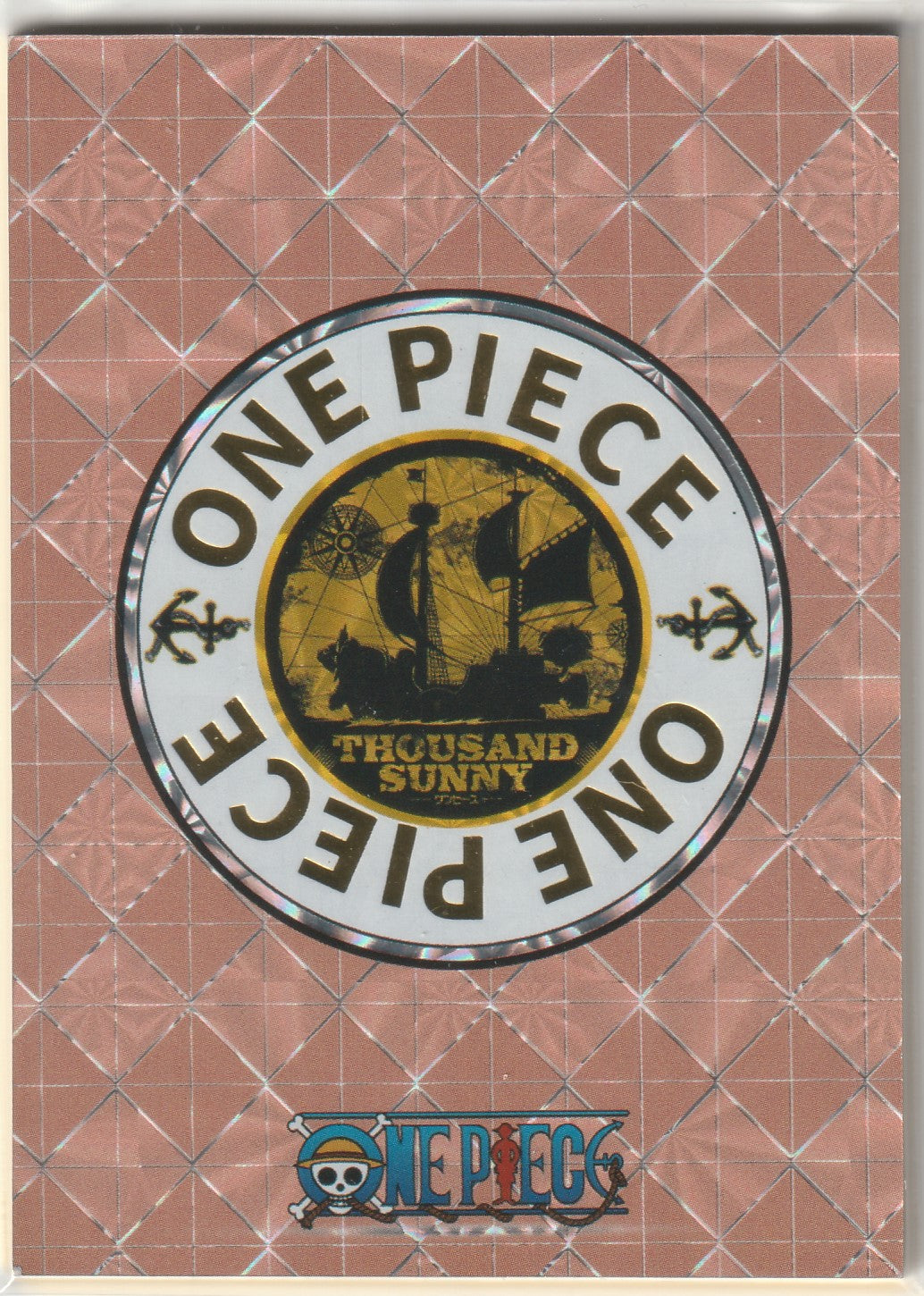 Back of One Piece STR collectible card with gold Thousand Sunny ship and reflective logo.