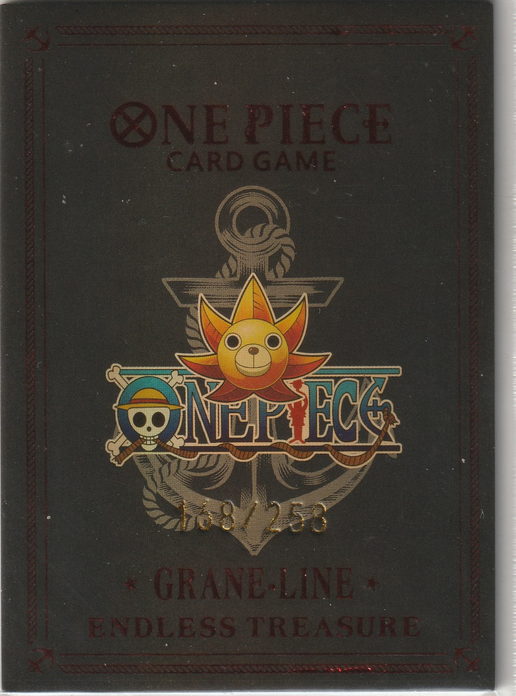 "One Piece card back with Thousand Sunny logo, embossed text, and numbering '168/258'."