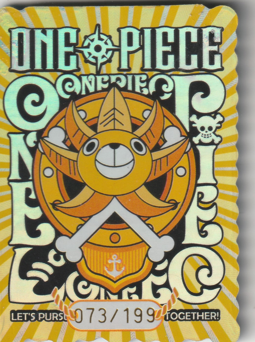 "Back of One Piece collectible card featuring Thousand Sunny emblem and serial number 073/199."