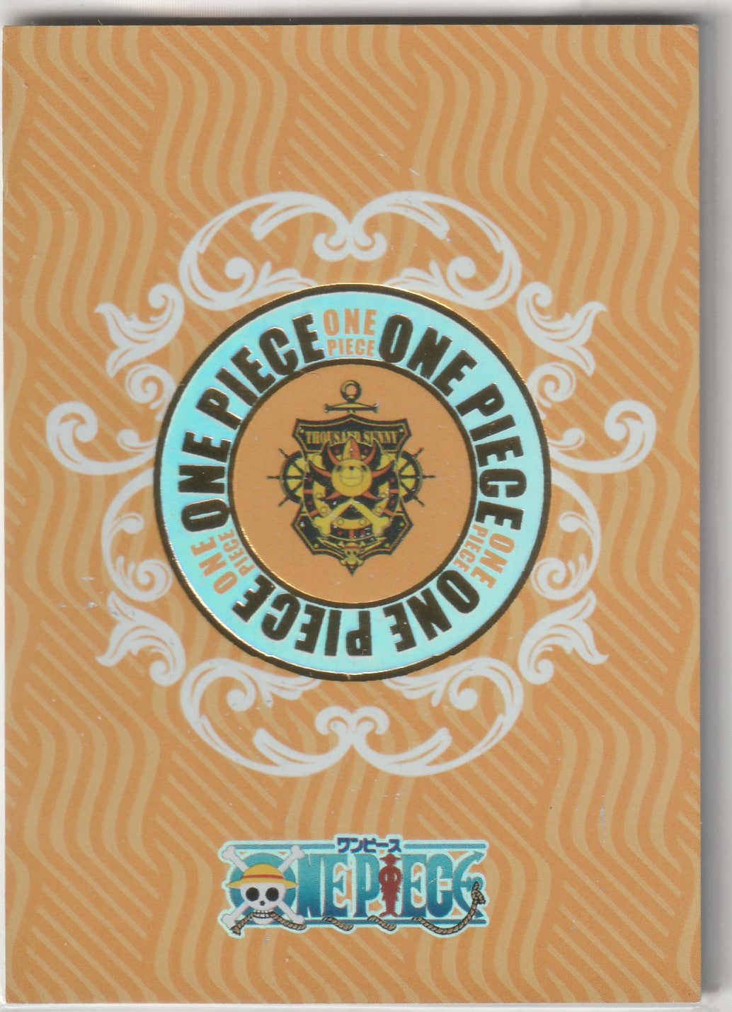 One Piece card back with orange wavy background, Thousand Sunny emblem, and ornate white scrollwork.
