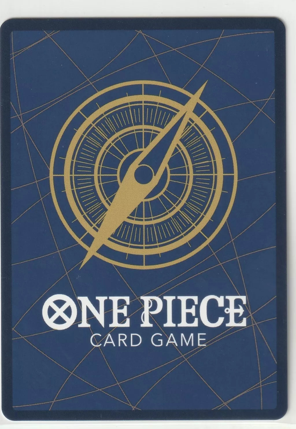 The back of a One Piece TCG card featuring a blue background, a golden compass, and the One Piece Card Game logo.