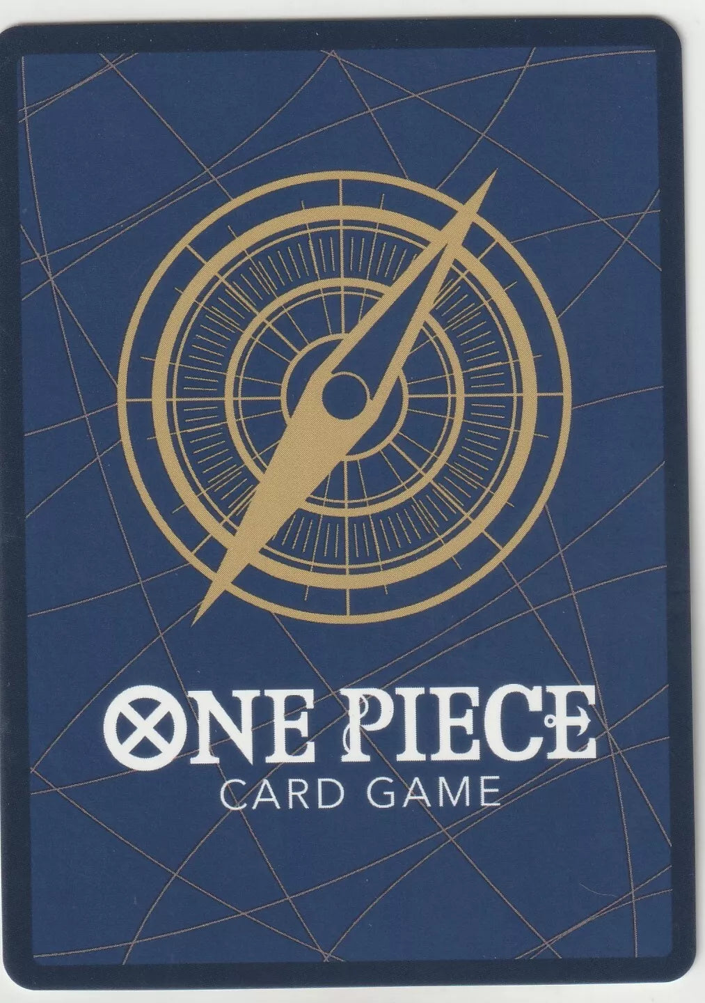 "One Piece Card Game back design with a golden compass on a navy blue background with subtle gold lines."