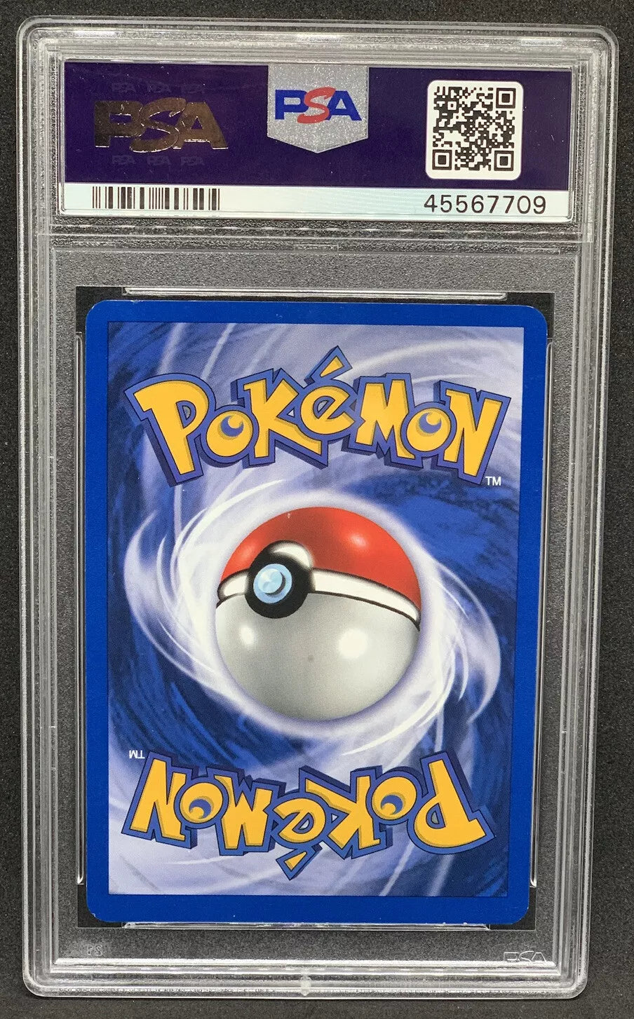 "Back view of a 2001 Espeon Neo Discovery Pokémon card encased in a PSA slab, showing the classic Pokéball design."