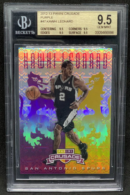 A holographic purple Prizm rookie card featuring Kawhi Leonard dribbling in a San Antonio Spurs uniform, graded 9.5 GEM MINT by Beckett.