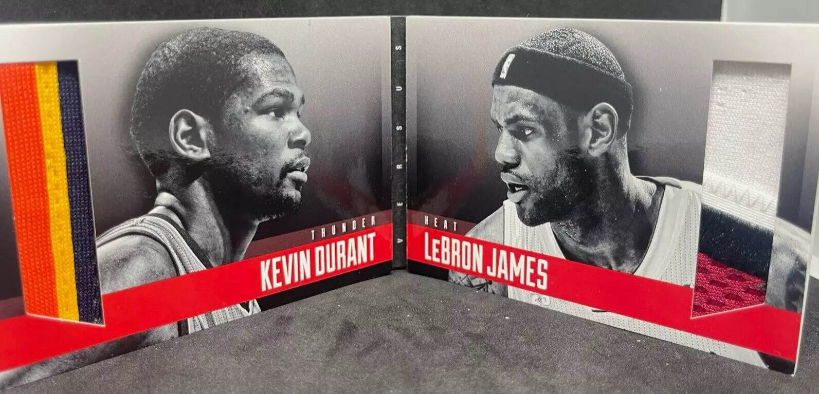 "Inside of the 2013-14 Panini Preferred Dual Patch LeBron James vs Kevin Durant card, featuring large game-worn patch swatches from both players, along with black-and-white profile images."