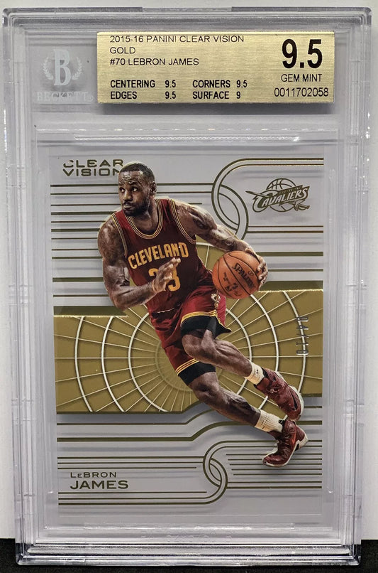 A clear acetate card featuring LeBron James driving to the basket in a Cleveland Cavaliers uniform, with gold accents, graded 9.5 GEM MINT by Beckett.