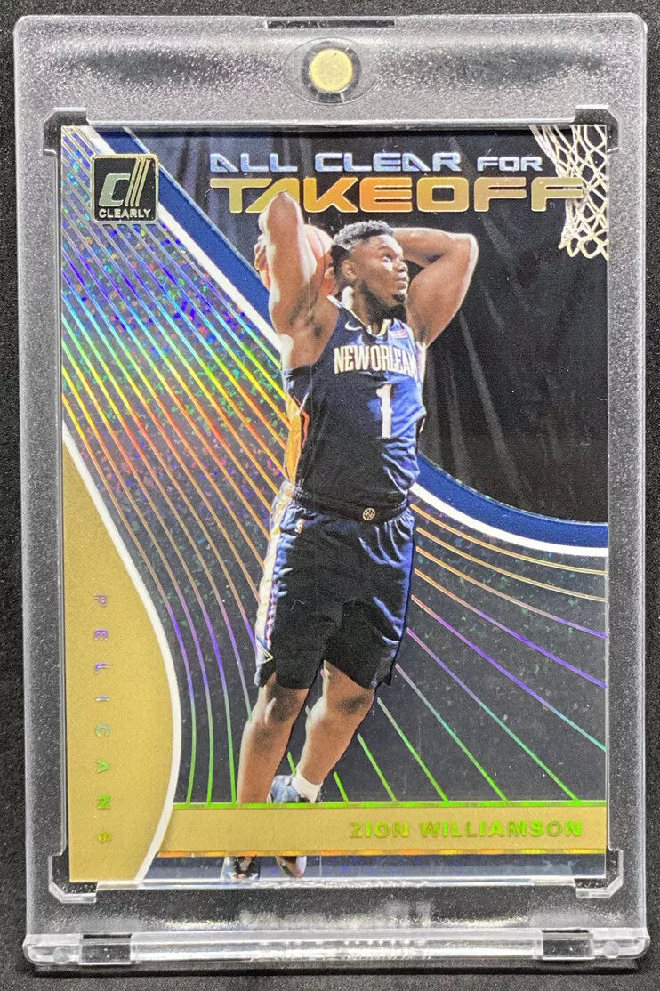 "2019-20 Panini Donruss Clearly All Clear for Takeoff Holo Gold Sparkle Zion Williamson Rookie Card featuring Zion preparing for a dunk with a gold sparkle holographic design."