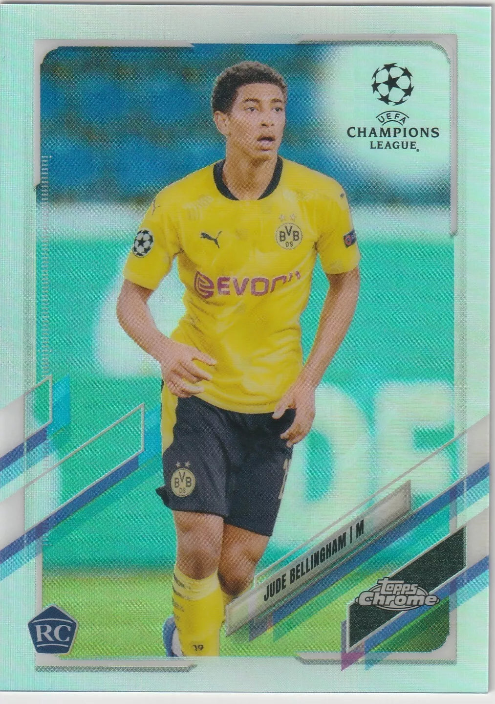 Jude Bellingham in Borussia Dortmund yellow kit, Topps Chrome silver refractor rookie card design, featuring UEFA Champions League logo and RC badge