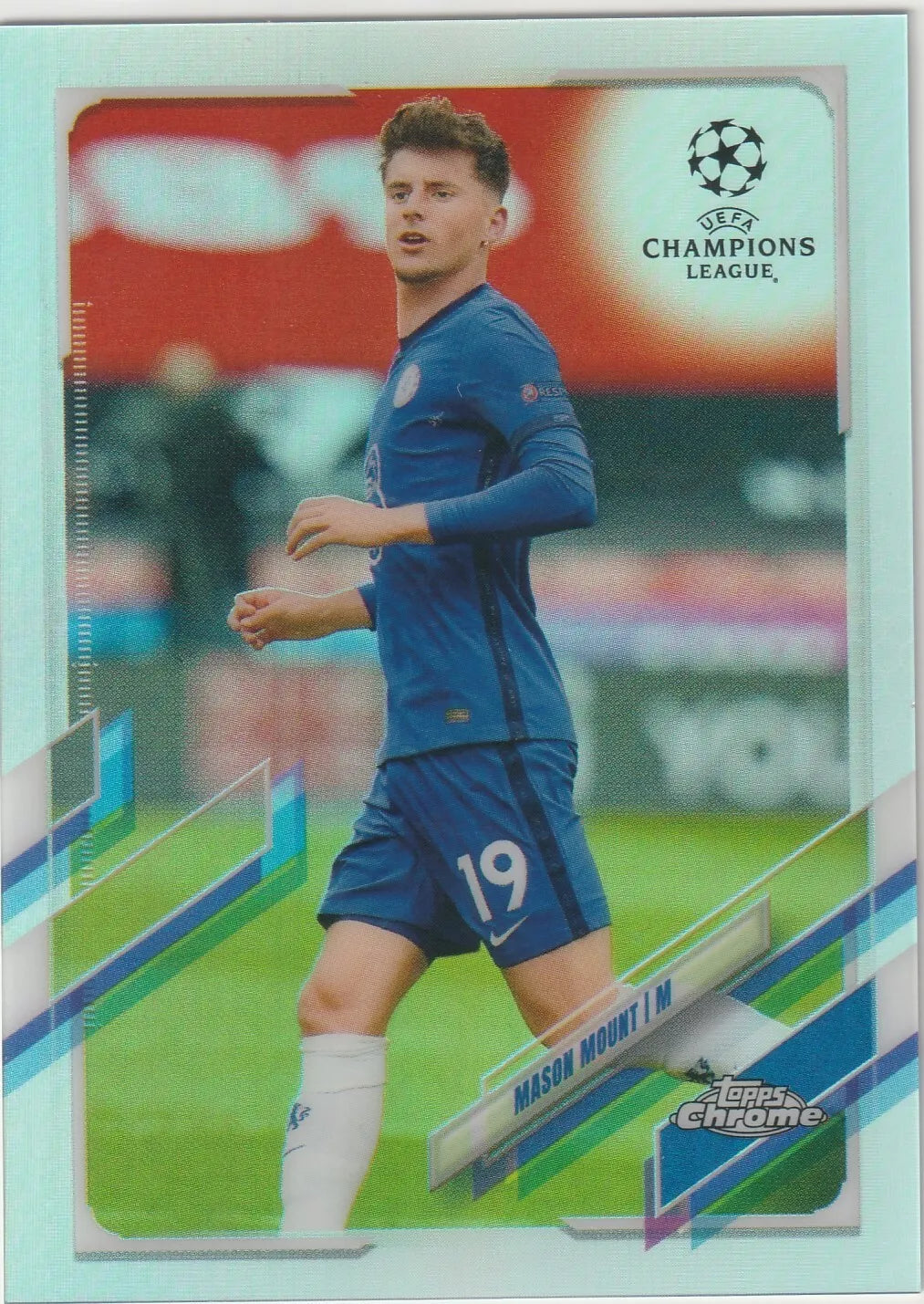 Mason Mount in Chelsea blue kit, Topps Chrome silver refractor card design, featuring UEFA Champions League and geometric background patterns.
