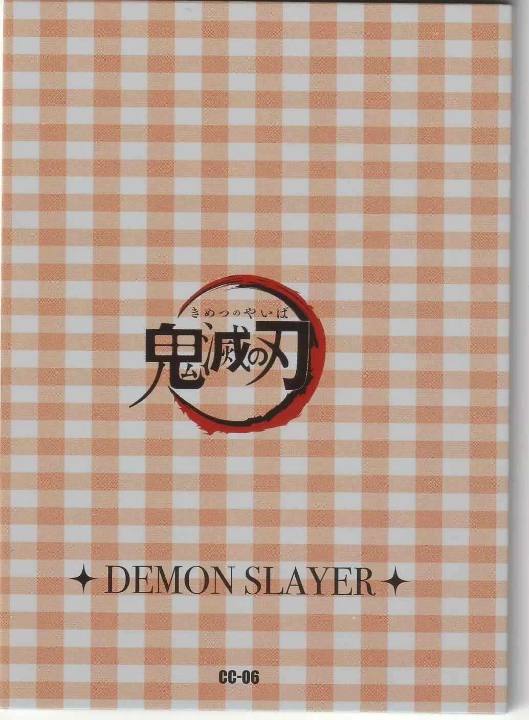 The back of the Demon Slayer card featuring a pastel gingham check pattern and the Kimetsu no Yaiba logo, with card number "CC-06."