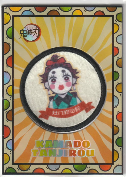 Kamado Tanjiro chibi design patch card from the Demon Slayer Entertainment District arc, featuring a cloth patch in the center, surrounded by colorful orbs and vibrant artwork.