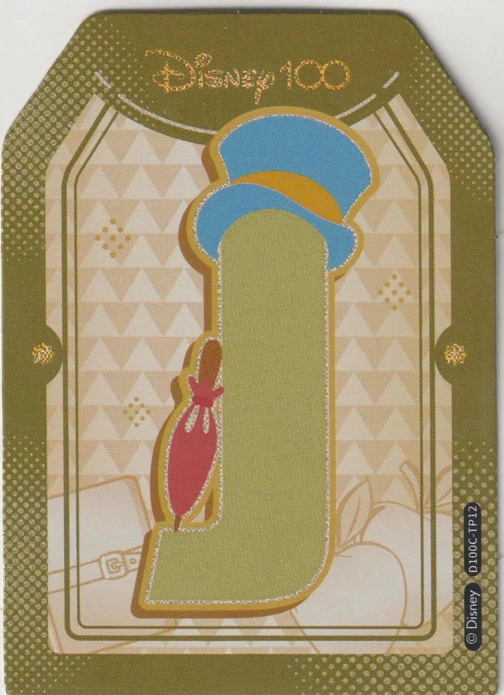 Disney 100 Alphabet Sticker featuring the letter 'J' for Jiminy Cricket from Pinocchio. The design includes Jiminy’s blue top hat and red umbrella, set against a geometric beige background with gold accents.