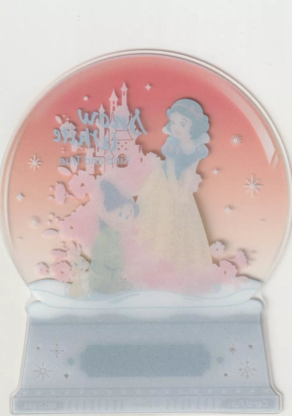 Reverse side of the Disney 100 Acetate Die Cut Snow Globe card with a mirrored image of Snow White and Dopey.