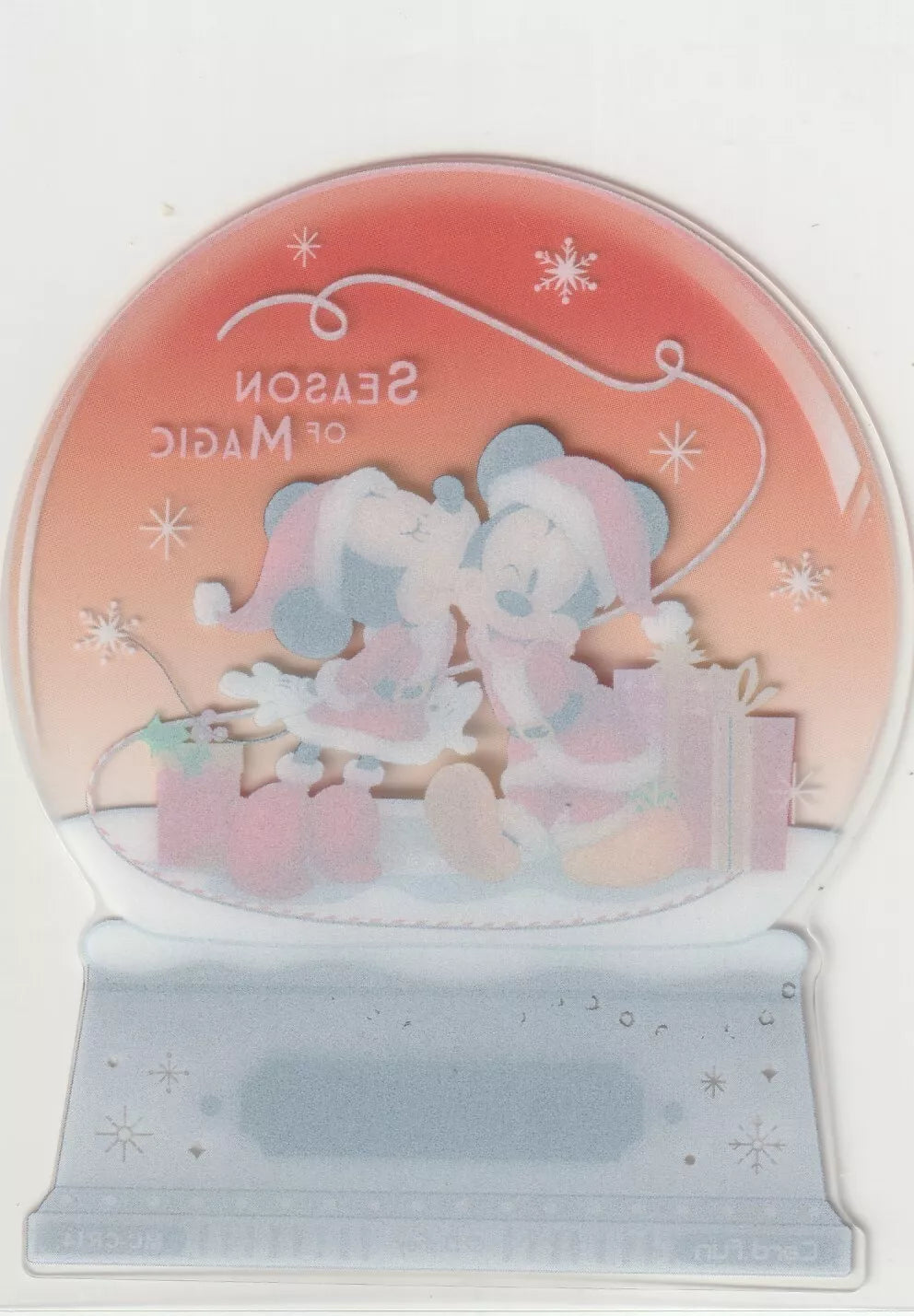 Back of Disney 100 Acetate Die Cut Snow Globe featuring a reversed view of Mickey and Minnie in Christmas scene.