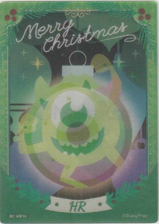 Lenticular card showing Mike Wazowski inside a green Christmas ornament, surrounded by festive decorations and "Merry Christmas" text.