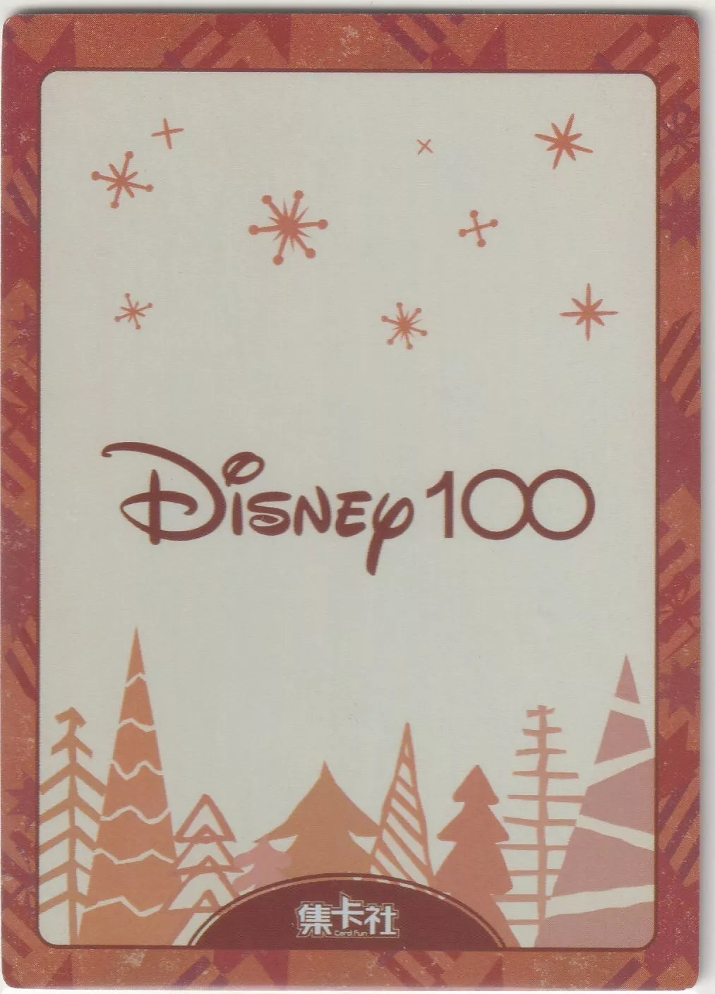 Disney 100 logo on a cream background with red and orange snowflakes and trees.