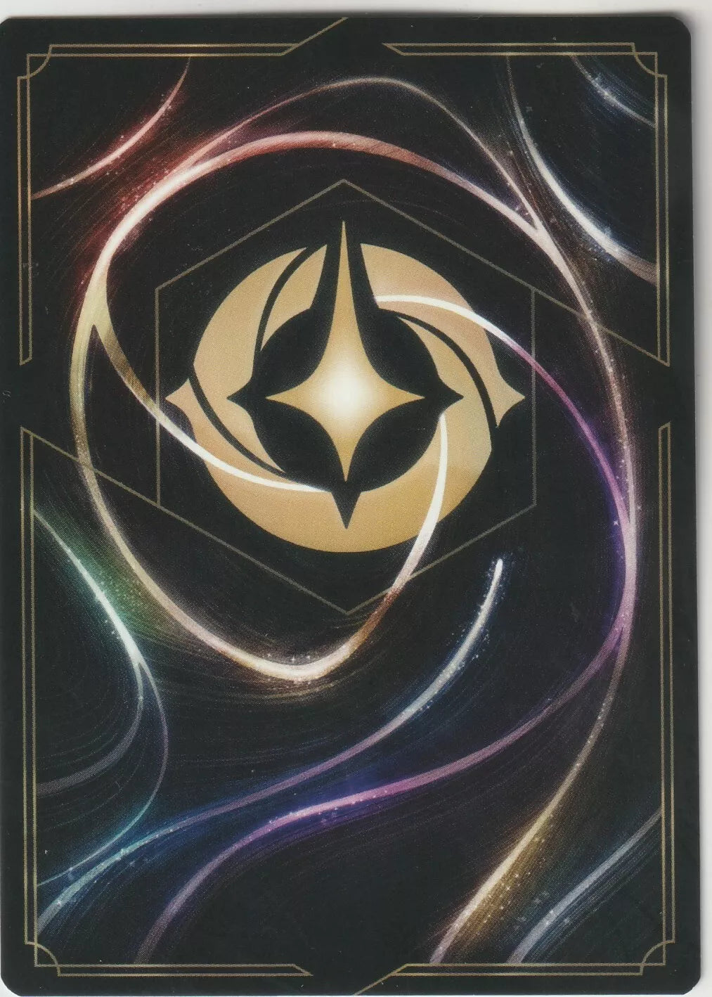 Disney Lorcana card back with a gold emblem on a black and colorful, swirling design.