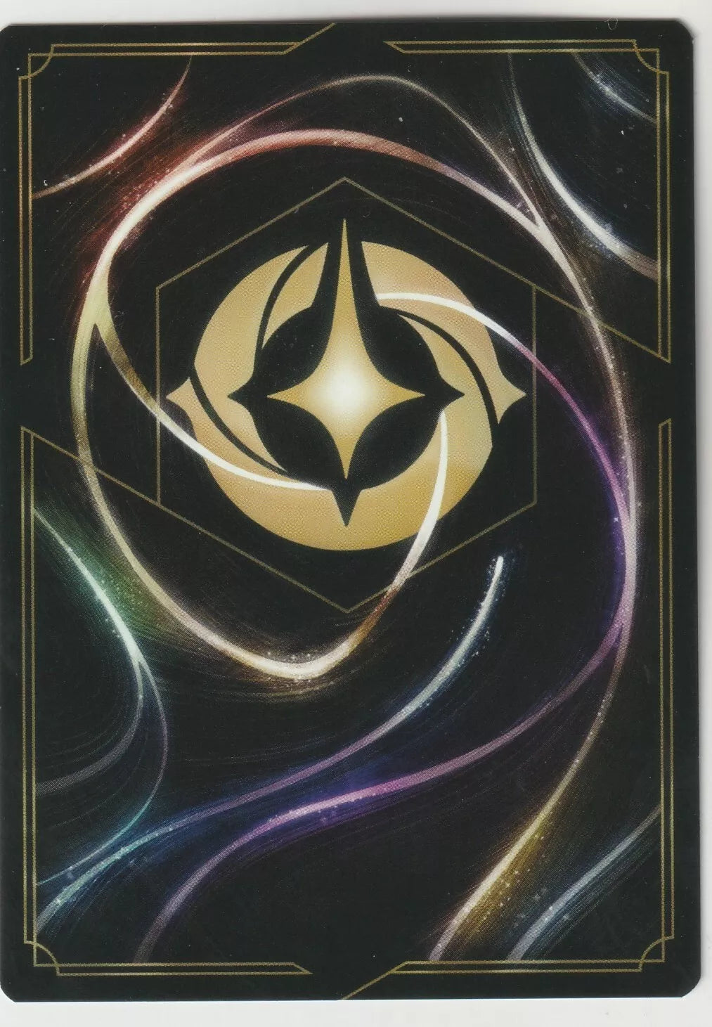 The back of a Disney Lorcana The First Chapter card, featuring a magical swirling design and the Lorcana symbol in the center.