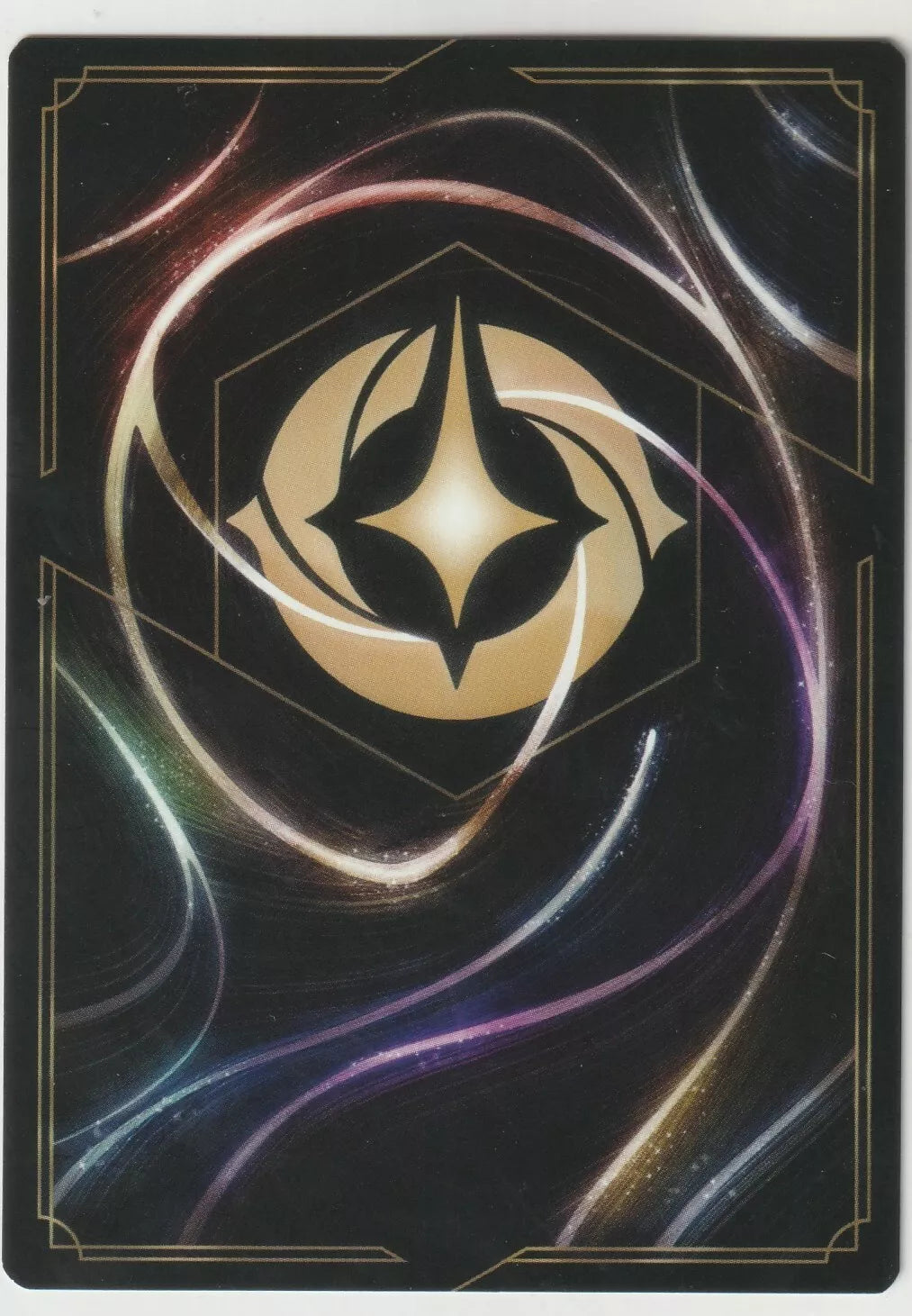 The back of a Disney Lorcana The First Chapter card, featuring a swirling magical design with a golden Lorcana symbol in the center.