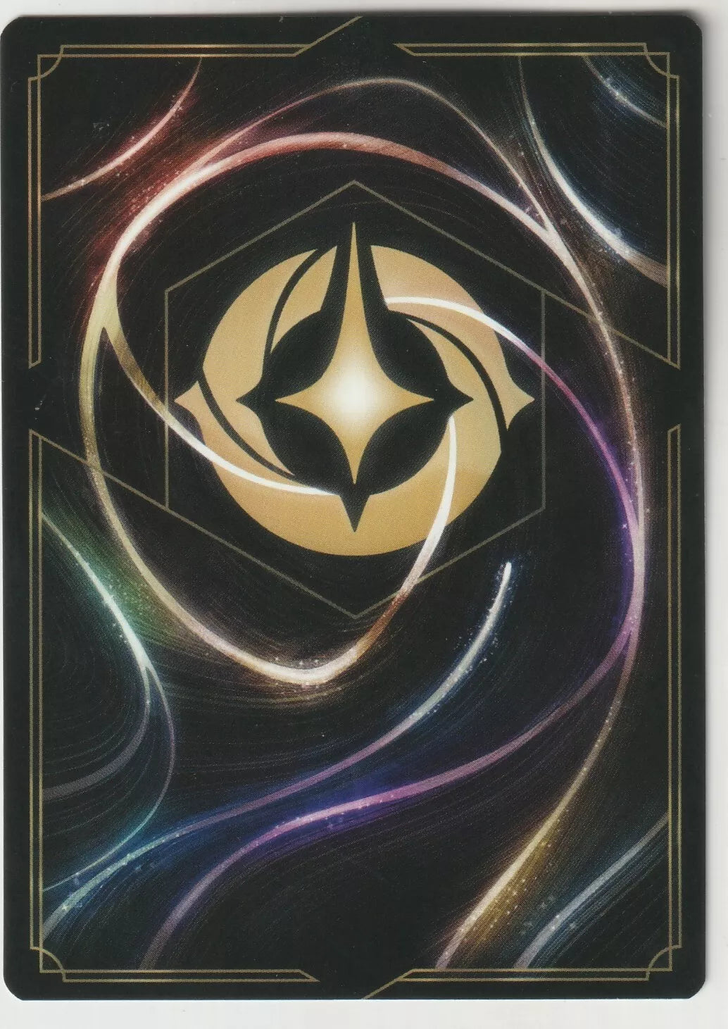 The back of a Disney Lorcana The First Chapter card, featuring swirling magical designs with a golden Lorcana symbol in the center.