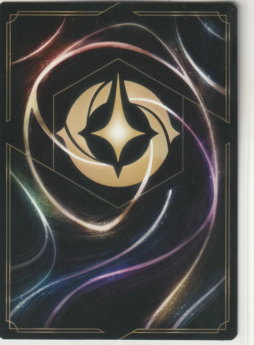 The back of a Disney Lorcana The First Chapter card, featuring swirling magical designs with a golden Lorcana symbol in the center.