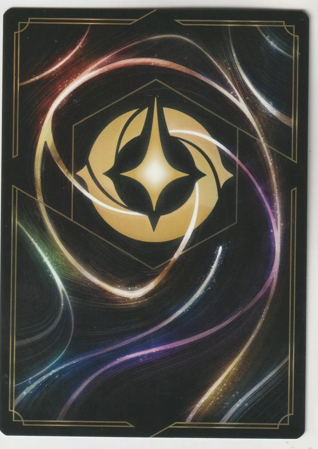 The back of a Disney Lorcana The First Chapter card, featuring swirling magical designs and the Lorcana golden symbol in the center.