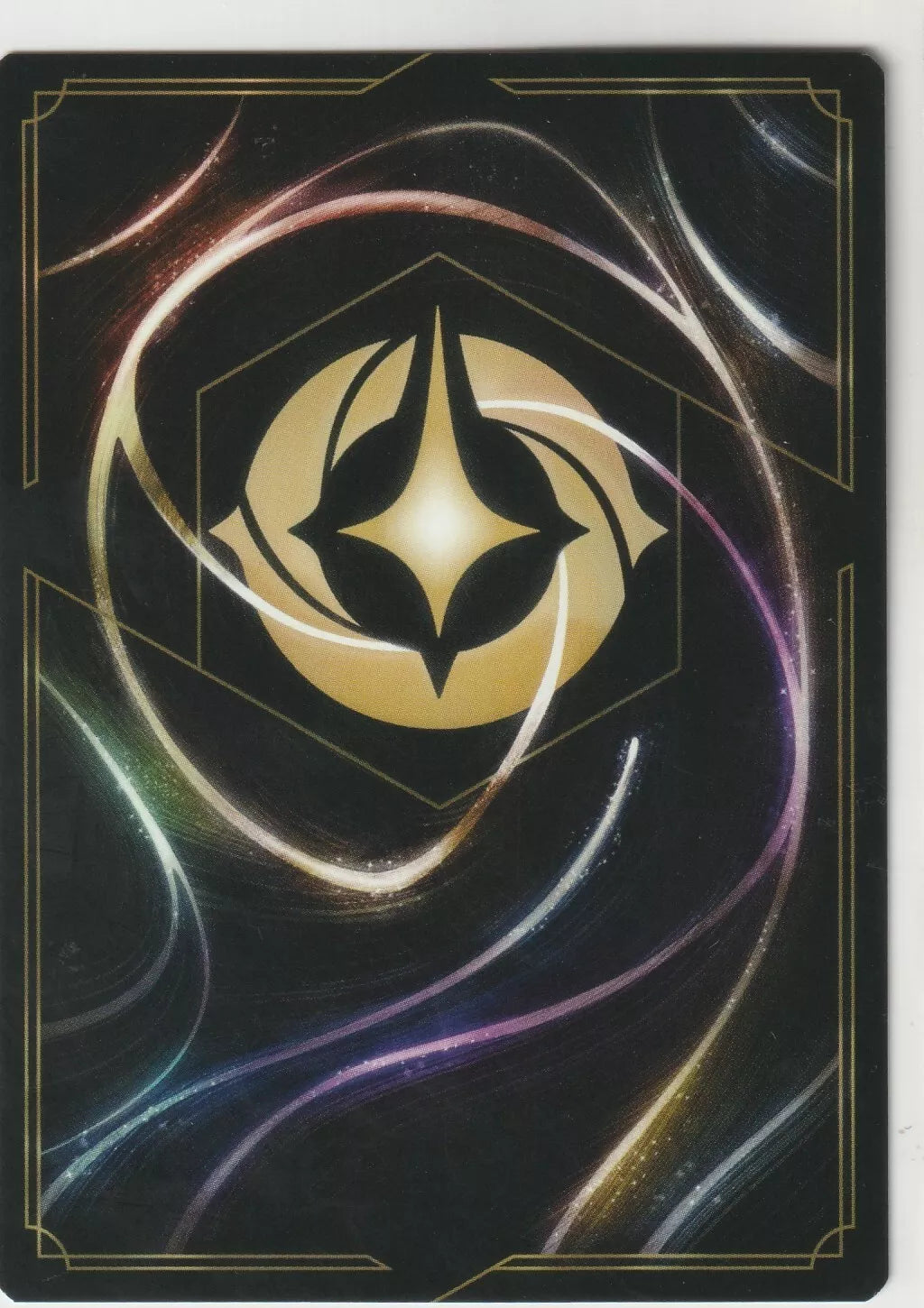 The back of a Disney Lorcana The First Chapter card, featuring swirling magical designs and the golden Lorcana symbol in the center.