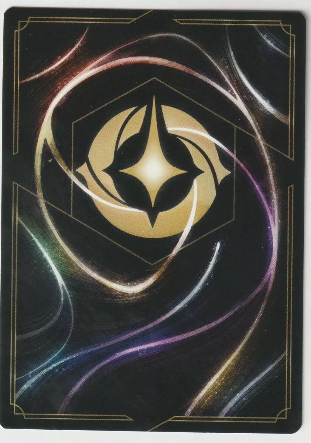 The back of a Disney Lorcana The First Chapter card, featuring swirling magical designs and the Lorcana golden symbol in the center.