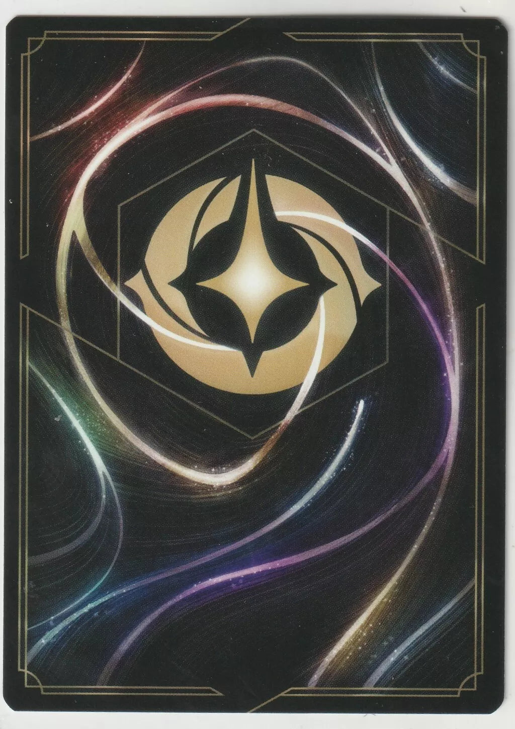 Back of a Disney Lorcana card, featuring a golden emblem on a cosmic background.