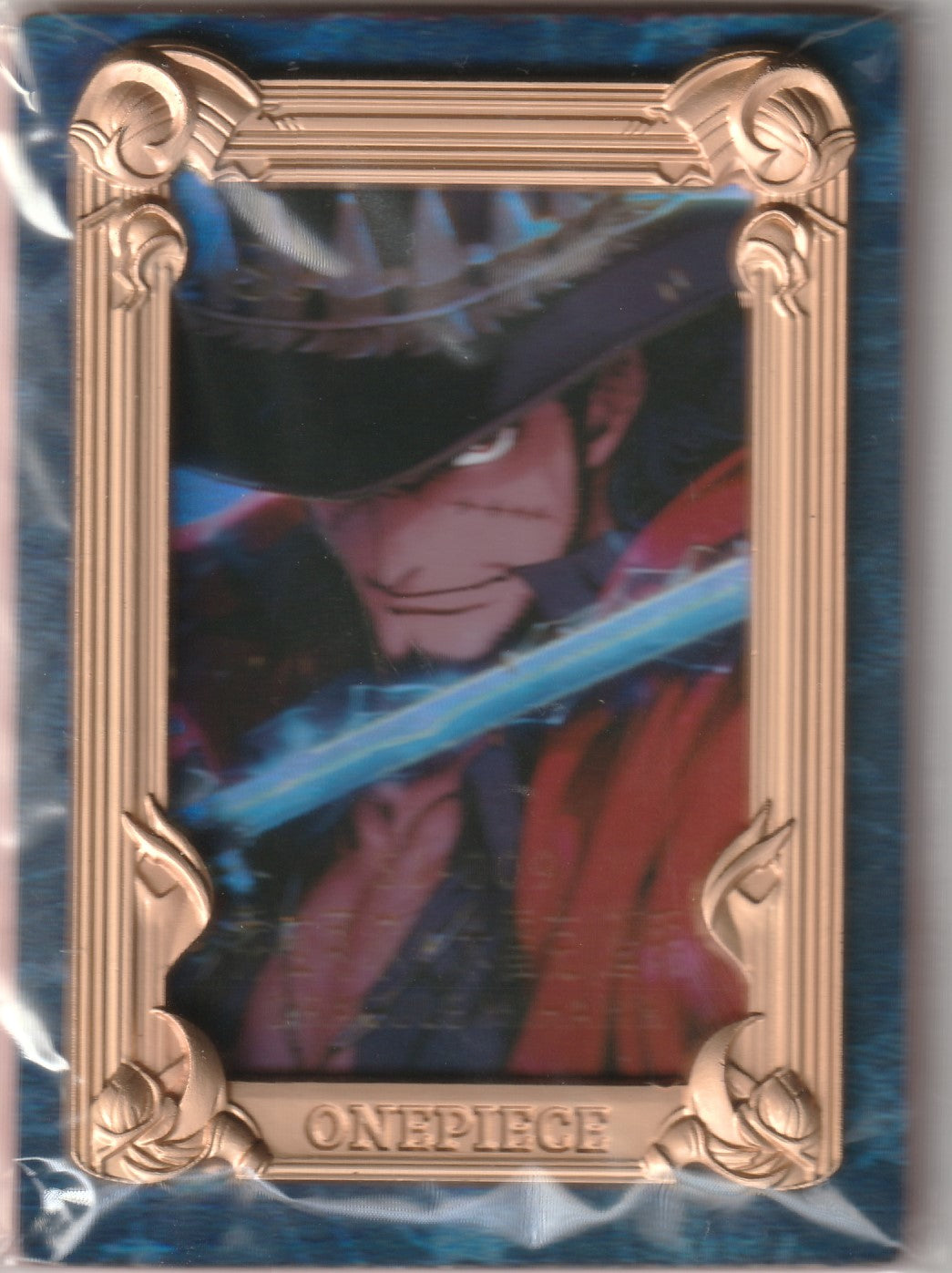 "One Piece Dracule Mihawk collectible card featuring a holographic illustration of Mihawk with his sword, framed in an ornate bronze metallic border."