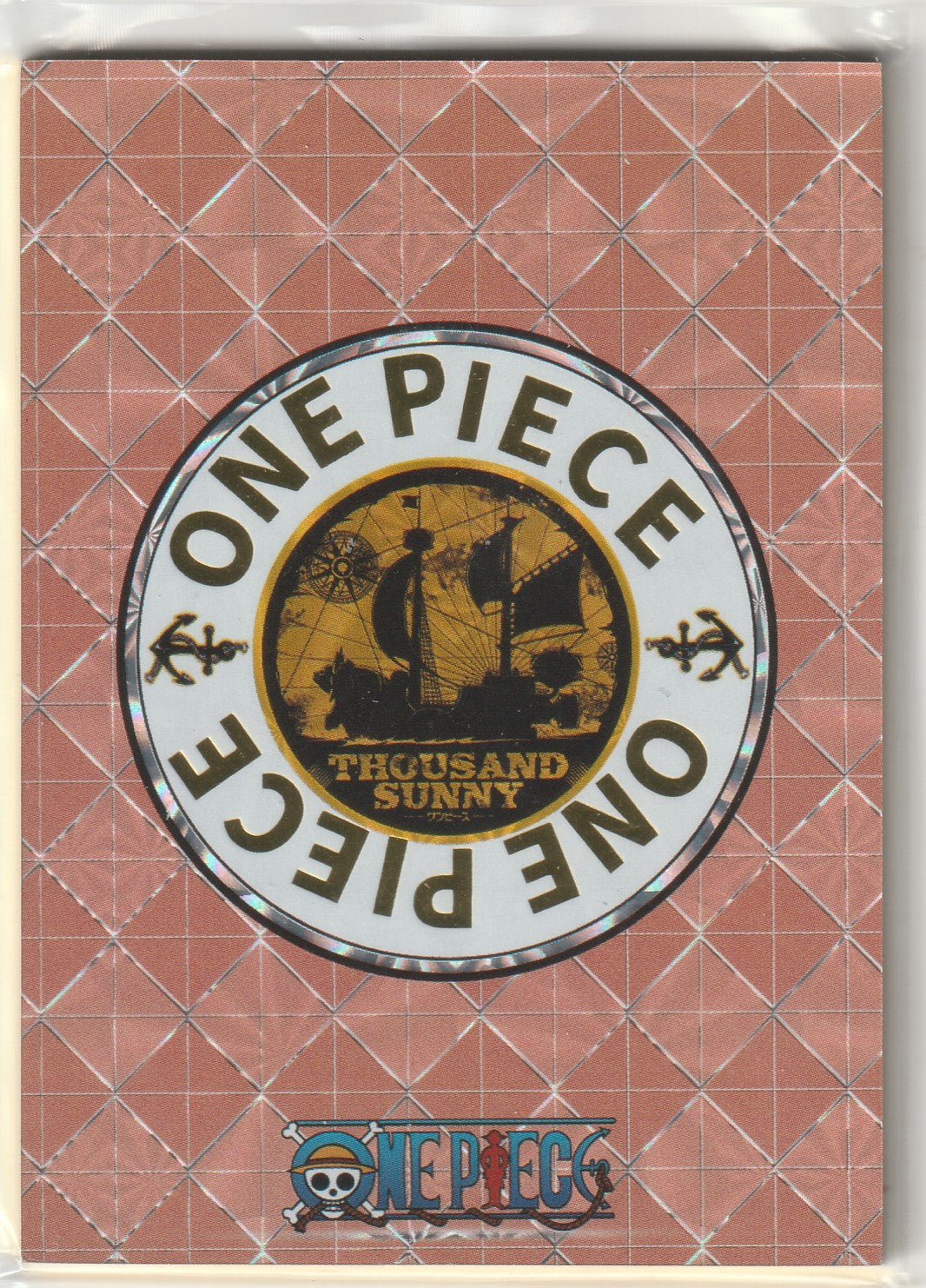 Back of One Piece card showing the Thousand Sunny ship in gold with a circular design, repeating 'ONE PIECE' and anchor symbols.