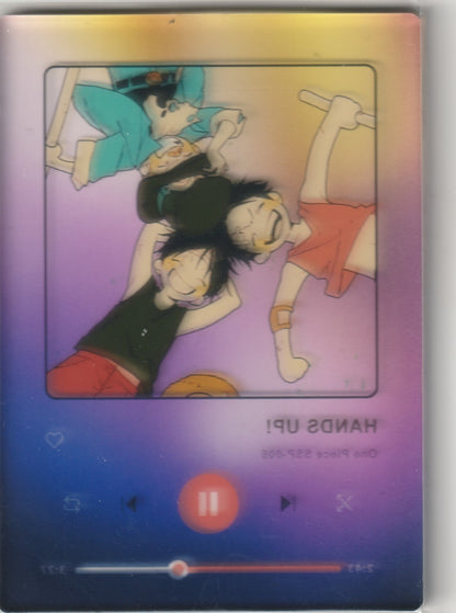 Back of One Piece card displaying the inverted design of Luffy, Ace, and Sabo within a music player interface