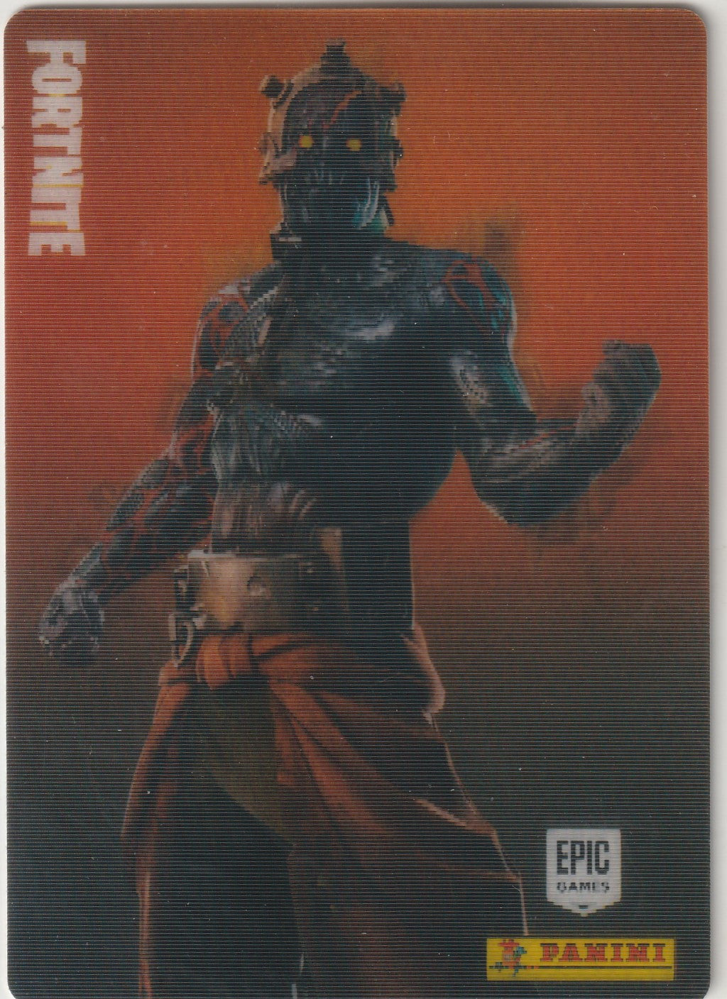 "Exclusive Fortnite trading card featuring the legendary The Prisoner outfit (#306). Showcasing the dark and futuristic design of this iconic character with glowing yellow eyes and bold orange accents. Official Epic Games x Panini collectible from the 2020 Series 2 . Features a lenticular 3D effect that changes the image at different angles, bringing the character to life!"

