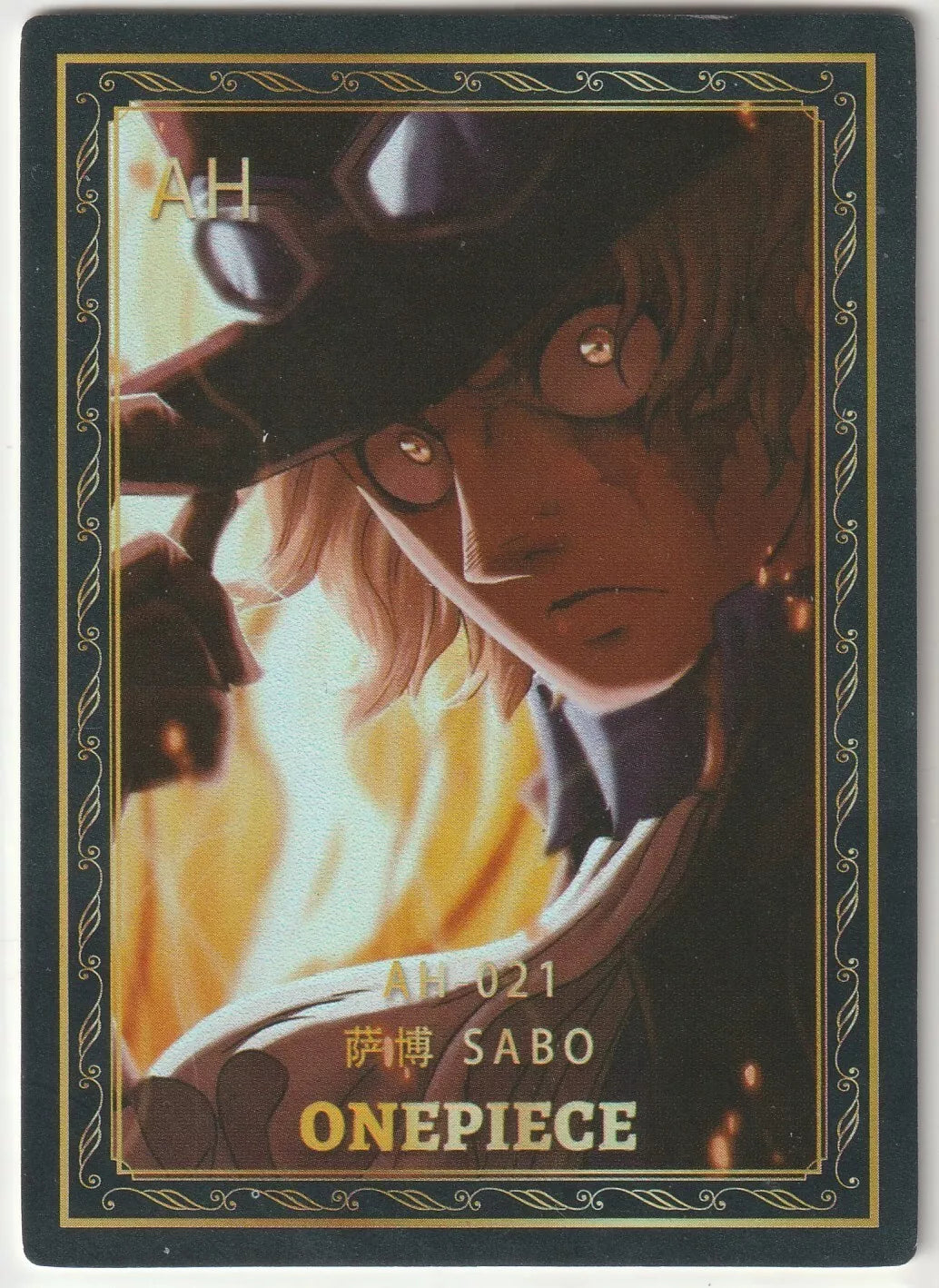 Close-up portrait of Sabo from One Piece AH-021 card, featuring his goggles, flames, and intense expression as the Flame Emperor.