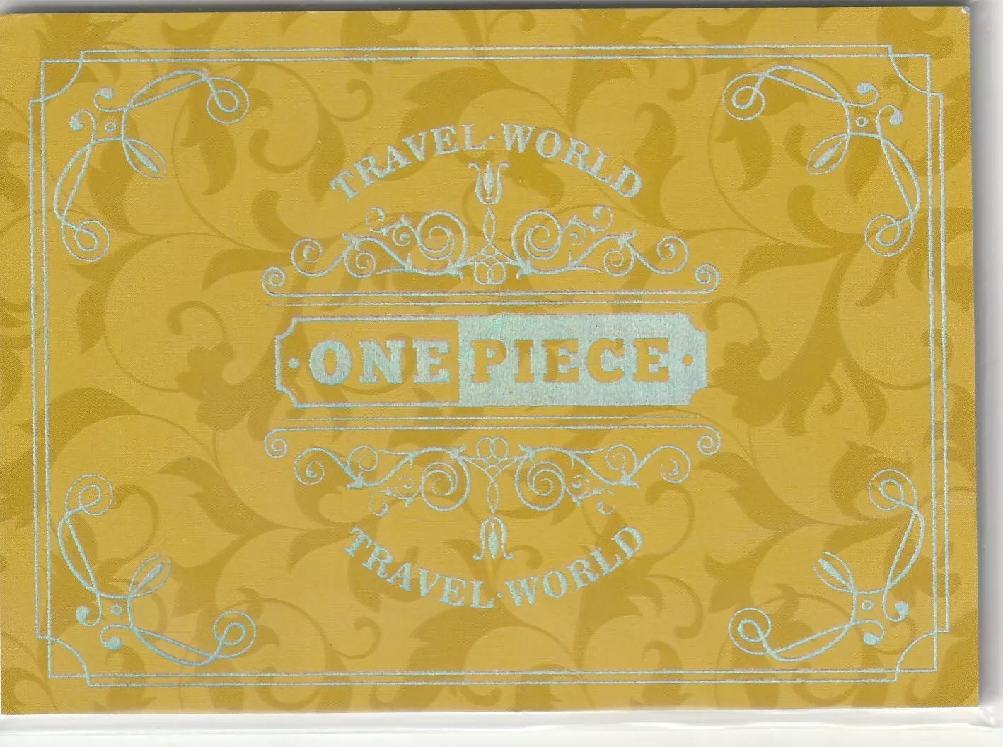 One Piece anime card back with gold floral pattern and silver-embossed 'Travel World' design and logo