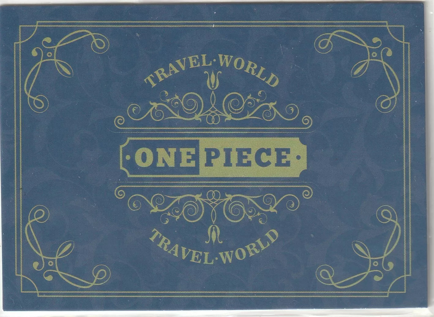 One Piece anime card back design with dark blue background, ornate golden decorations, and 'Travel World' text surrounding a central 'ONE PIECE' logo in a golden box.