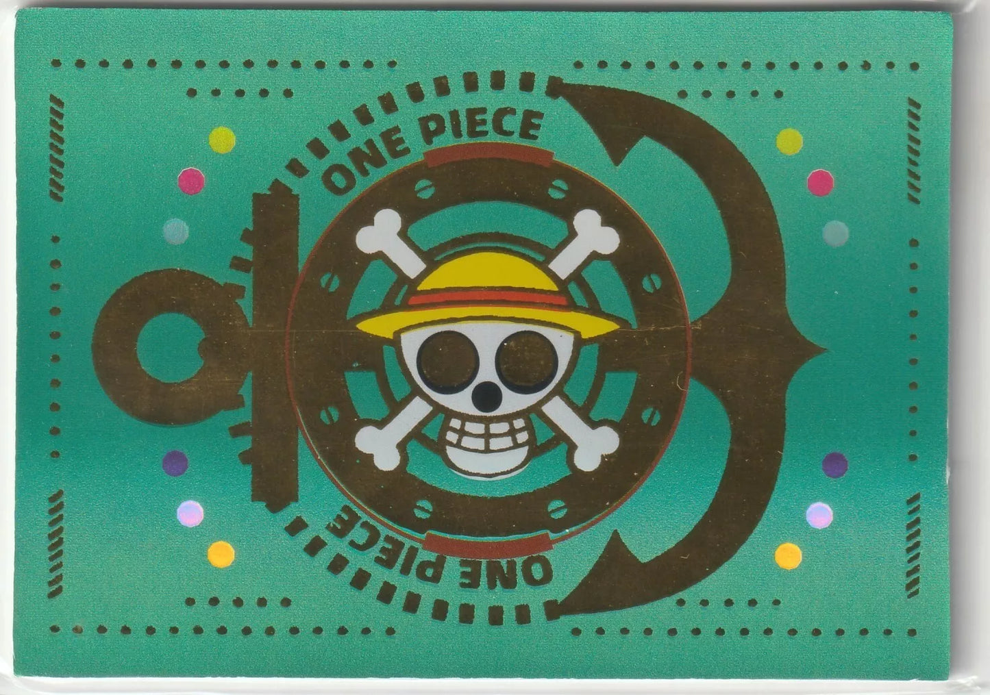 One Piece card back featuring the Straw Hat Pirates emblem encircled by 'One Piece' text, on a vibrant green background with scattered colorful dots.