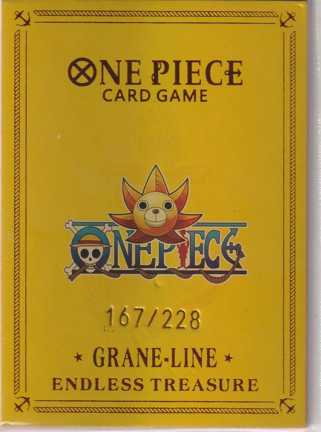 One Piece card back with a yellow background, Straw Hat Pirates emblem, and the serial number 167/228 from the Grane-Line Endless Treasure set.