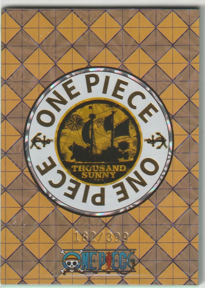 The back of an anime card featuring the One Piece logo with the Thousand Sunny ship in a golden theme and a yellow grid design, marked as 182/399.