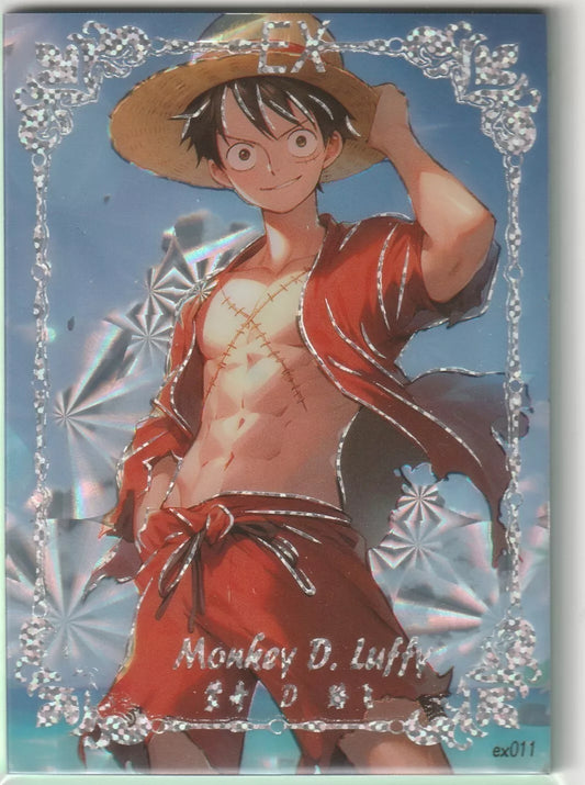 An anime card featuring Monkey D. Luffy from One Piece at the beach, smiling in a red beach outfit, with a foil finish and surrounded by ornate silver borders.