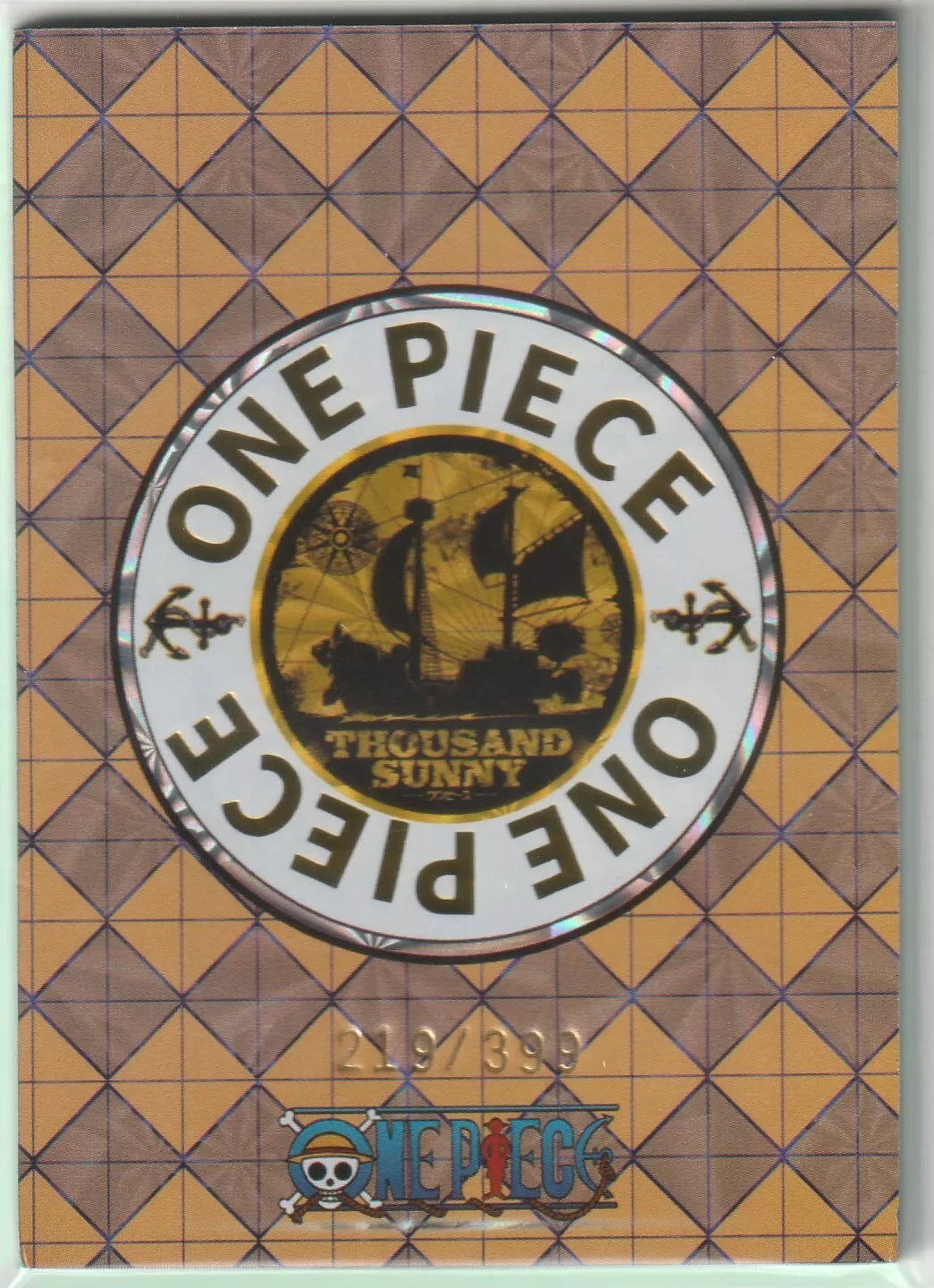 The back of an anime card featuring the One Piece logo and the Thousand Sunny ship, marked as 219/399, set against a yellow diamond-grid background.