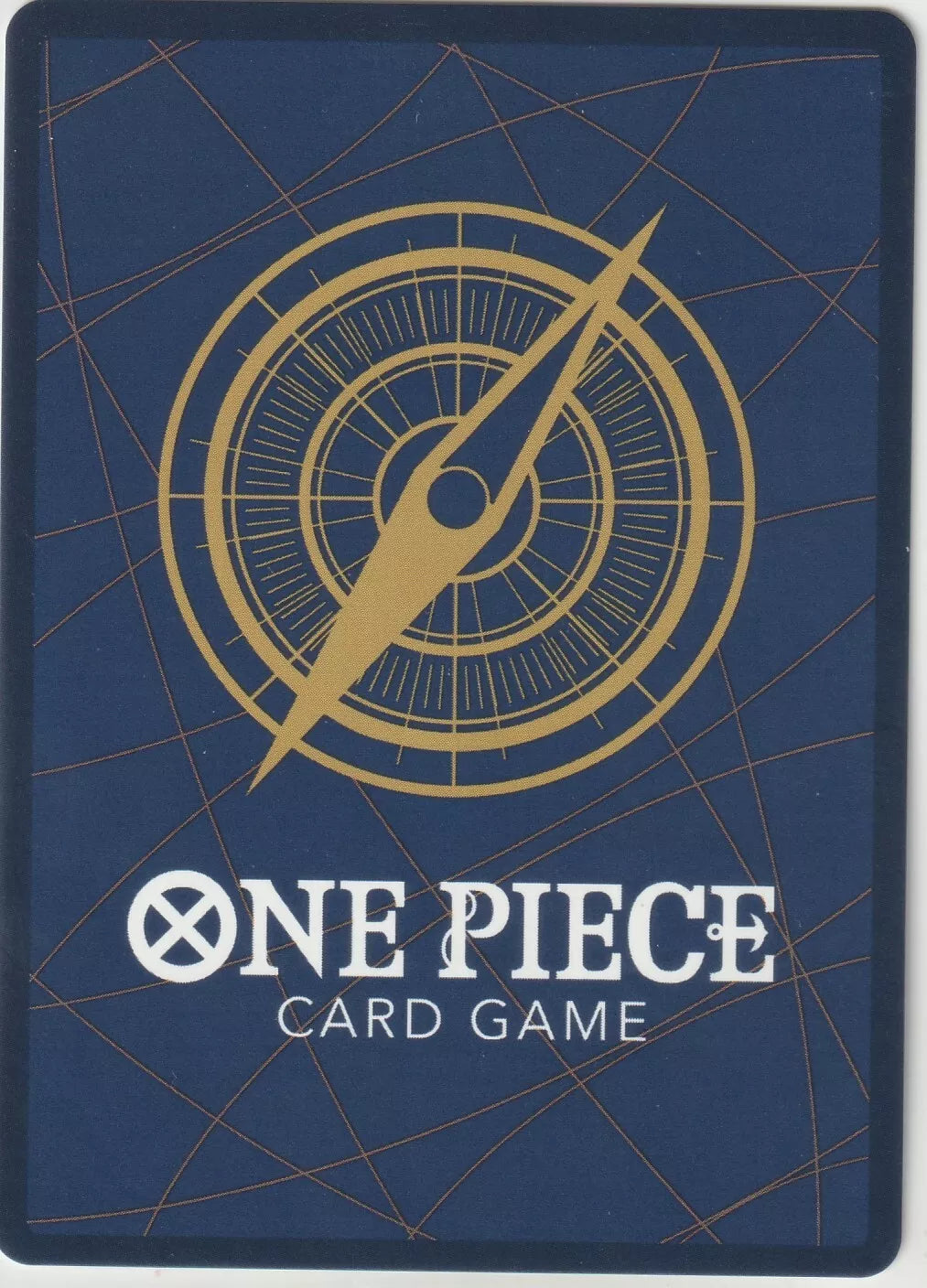 The back of a One Piece TCG card featuring a blue background, a golden compass motif, and the One Piece Card Game logo.