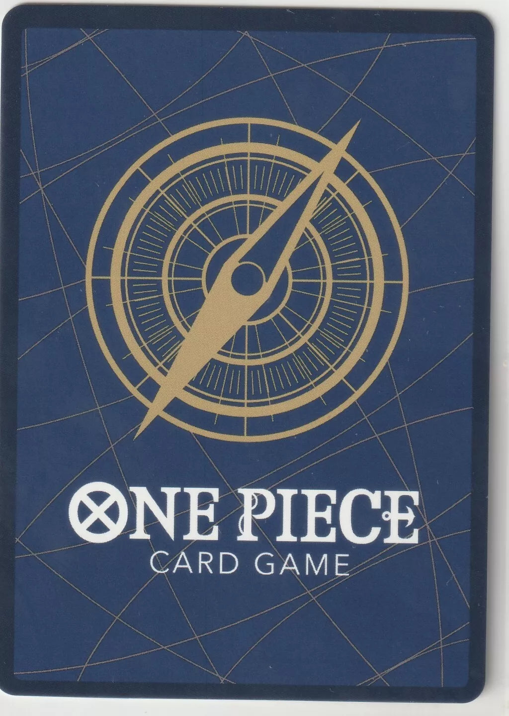 "One Piece Card Game back design featuring a golden compass on a navy blue background with subtle gold lines."