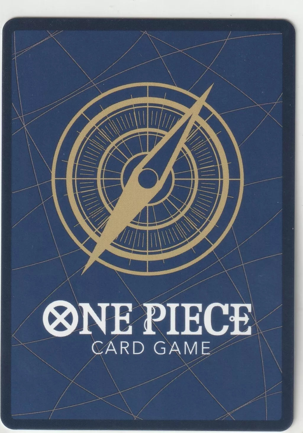 "One Piece Card Game back design with a golden compass on a navy blue background and subtle gold lines."