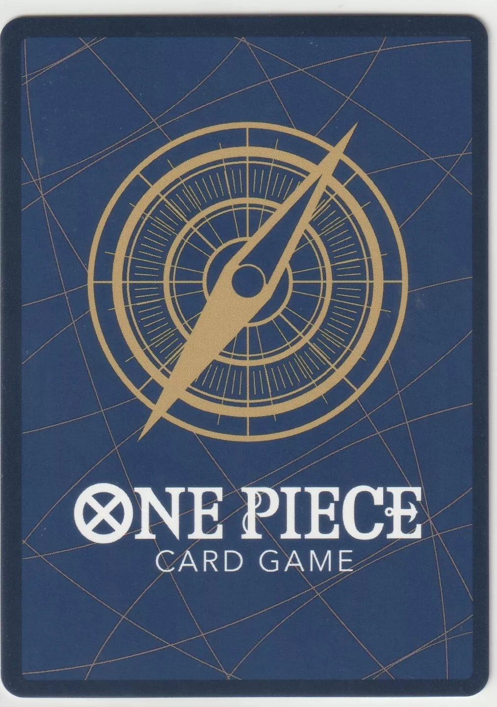 "One Piece Card Game back design with a golden compass on a navy blue background with subtle gold lines."