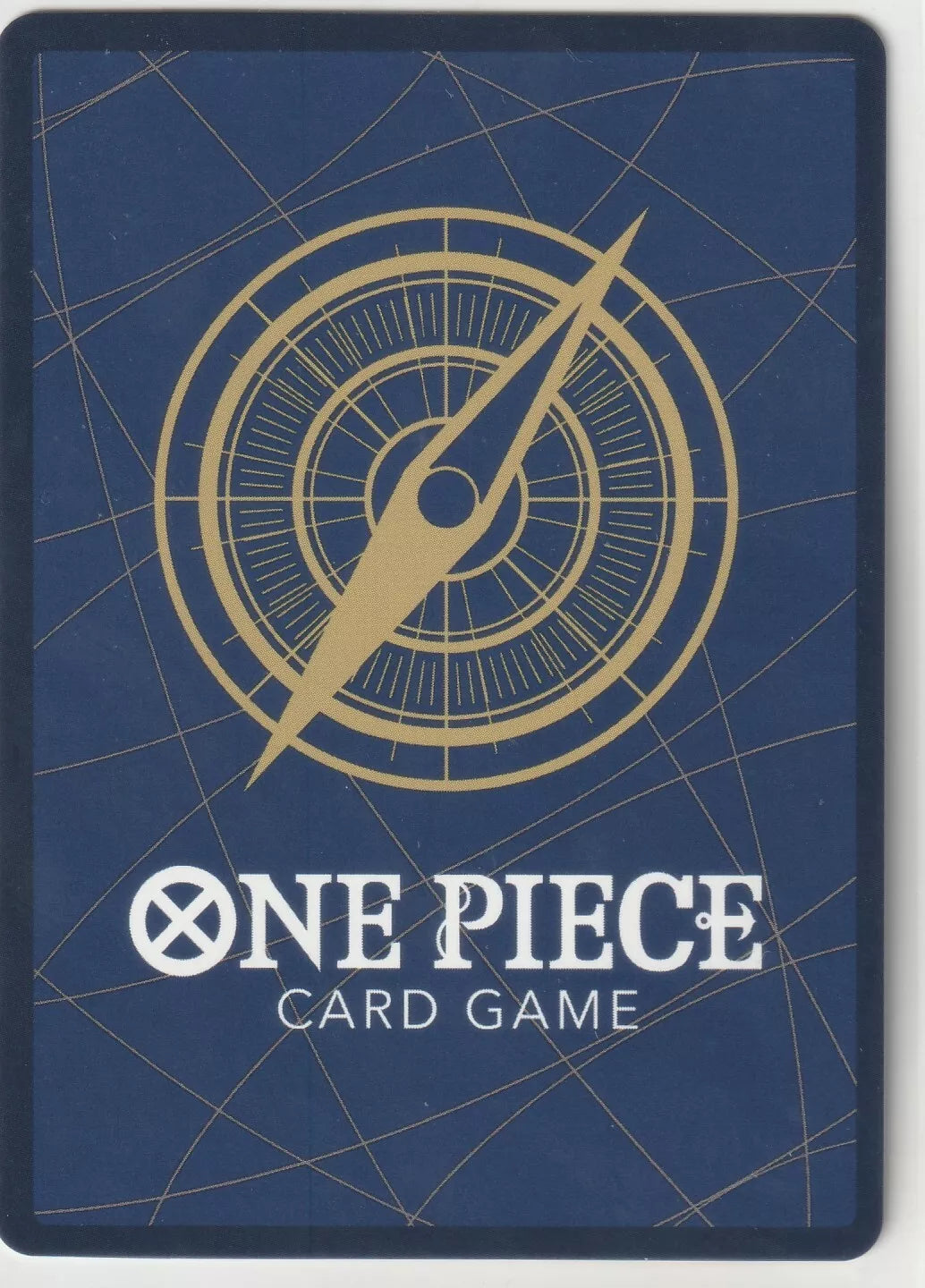 "Standard back design of One Piece Card Game with compass and logo in gold on a dark blue background."