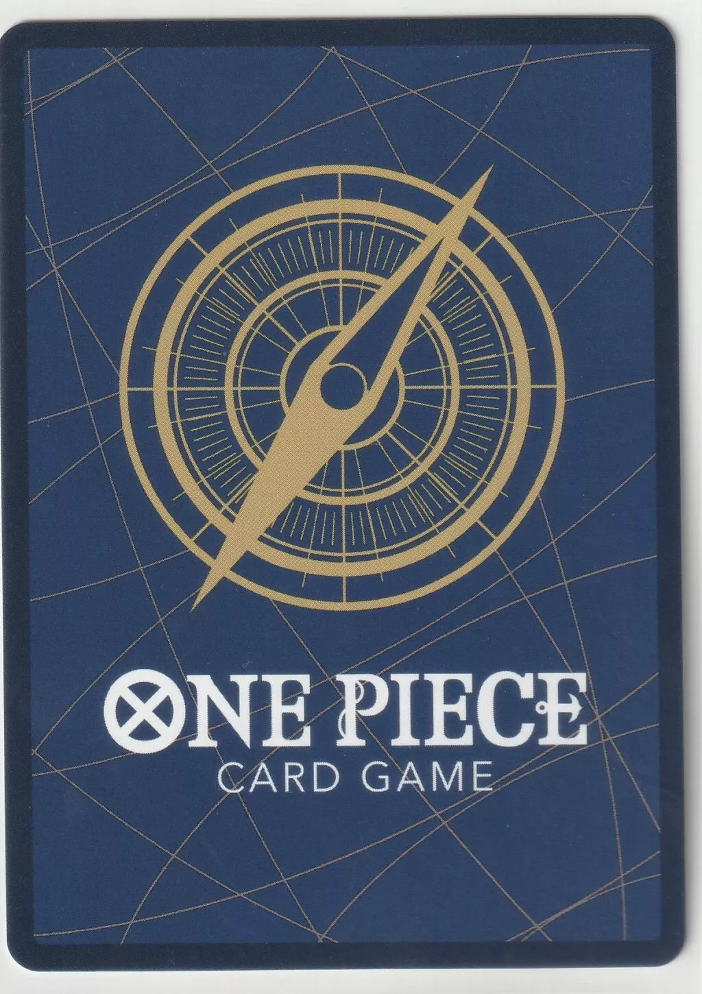 A compass design in gold over a deep blue background with the One Piece Card Game logo beneath it.