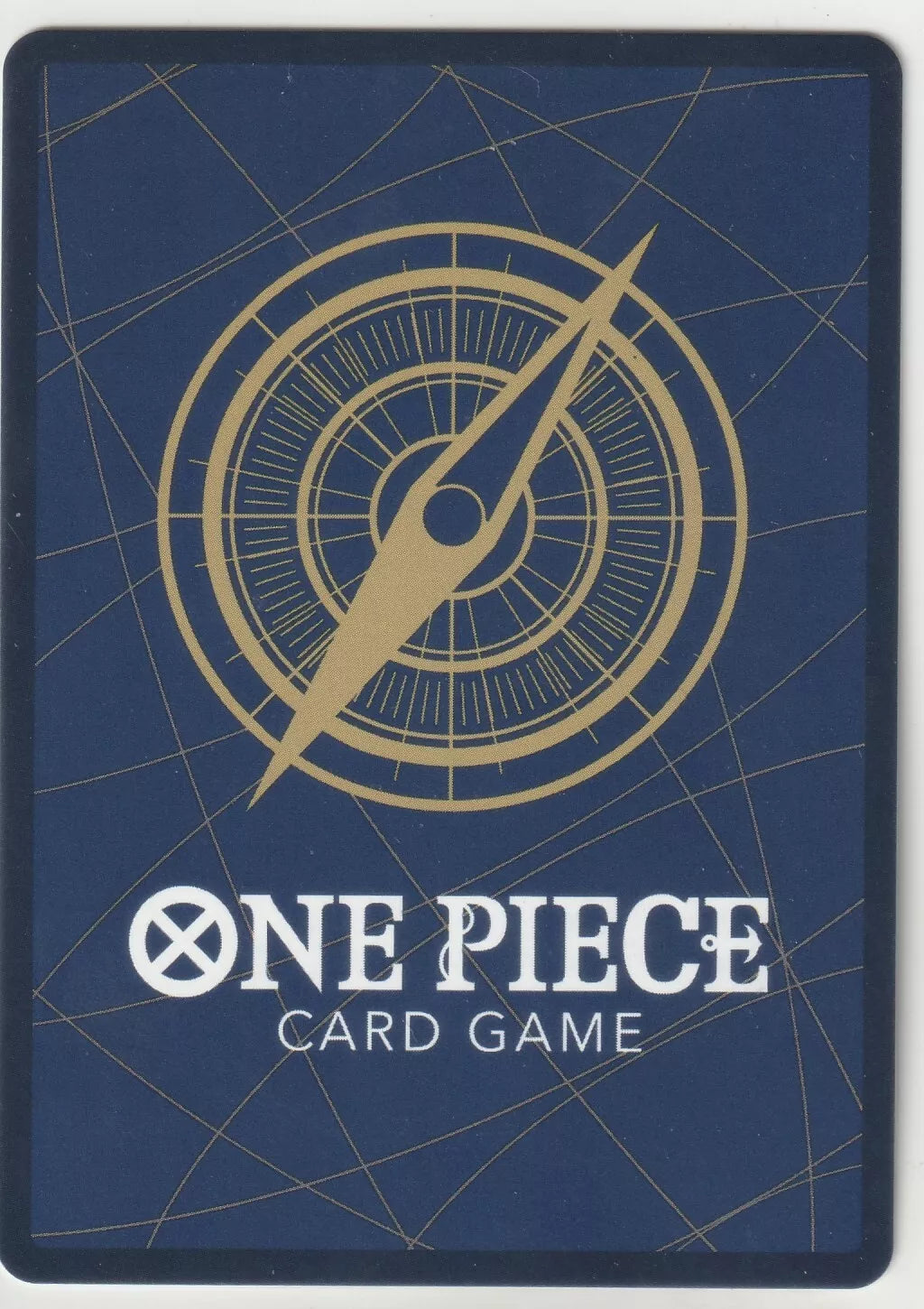 "Back of a One Piece TCG card featuring a golden compass design on a deep blue background."