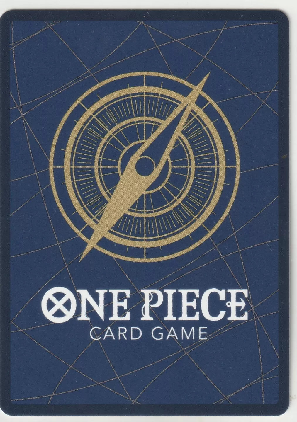 Back of a One Piece TCG card featuring a golden compass design on a deep blue background.